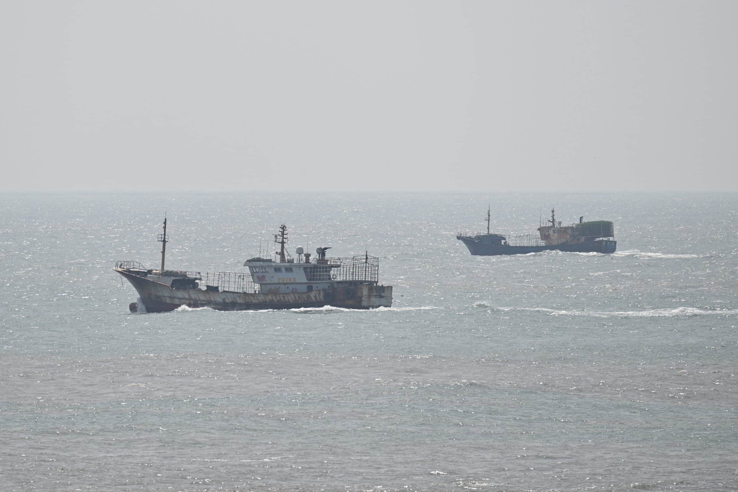 Boats sail next to Pingtan island, the closest point between China and Taiwan's main island, in Fujian province on April 2, 2025. (Photo by Hector RETAMAL / AFP)