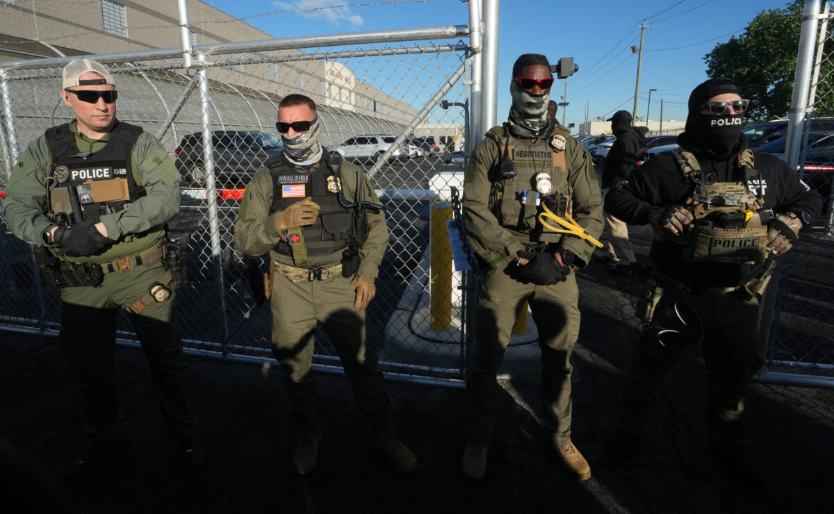 Immigration and Customs Enforcement agents stand near a gate at Delaney Hall, a newly converted immigrant detention center in Elizabeth, New Jersey May 7, 2025. Delaney Hall has the ability to hold over a 1000 people, and the detention facility, privately owned by The GEO Group, holds a contract with the federal government to house people arrested by ICE. — Photo by Agence France-Presse