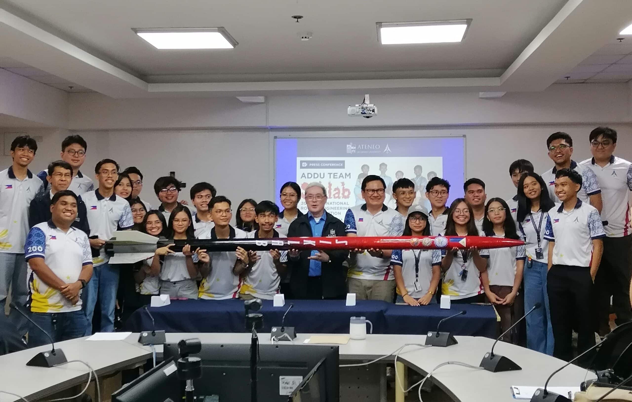 The whole Ateneo de Davao University Rocketry Team with AdDU President Fr. Karel S. San Juan and their mentor Dr. Rogel Mari Sese.