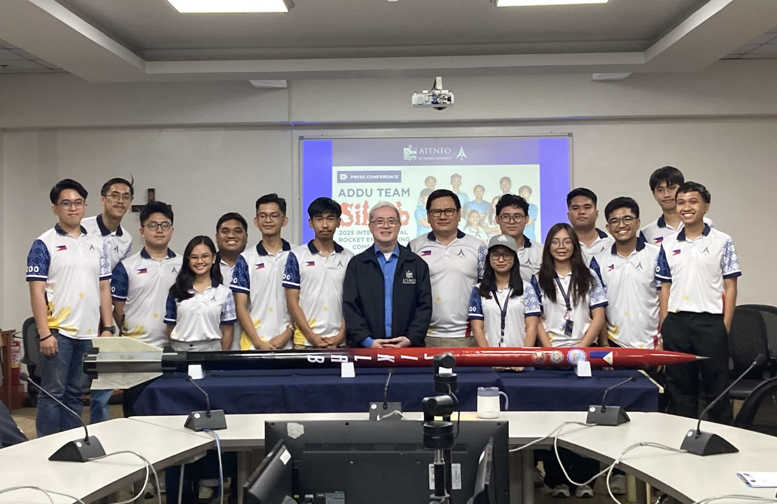 The 13-member AdDU Rocketry Team with their rocket named "Siklab" together with AdDU President Fr. Karel S. San Juan and Dr. Rogel Mari Sese, the only Philippine team to compete in the 2025 Intercollegiate Rocket Engineering Competition (IREC) in Midland International Air and Space Port in Midland, Texas, USA. Photos by Joselle R. Badilla